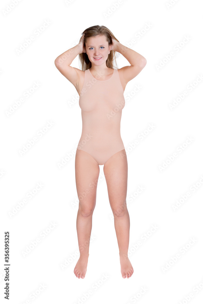 Beautiful young woman wearing beige colored swimsuit Beautiful young woman wearing beige colored swimsuit