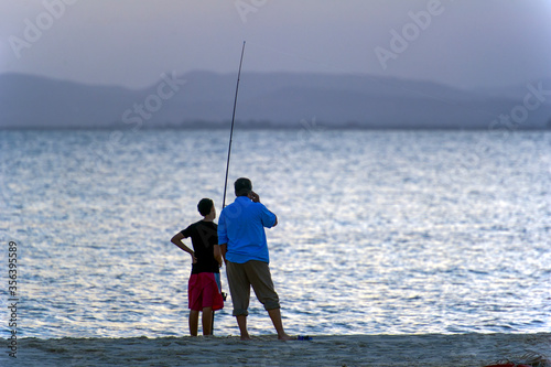 Tunisia, Cap Bon. Hammamet. Fisherman and his son