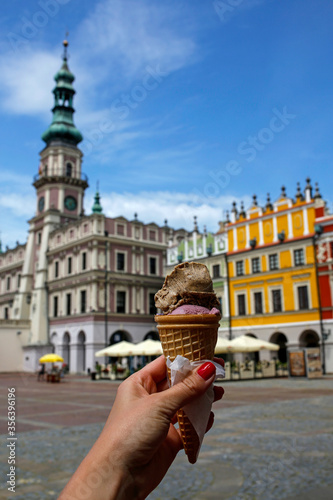 scoop ice cream in a cone kept by a woman on the market square in Zamość, Poland