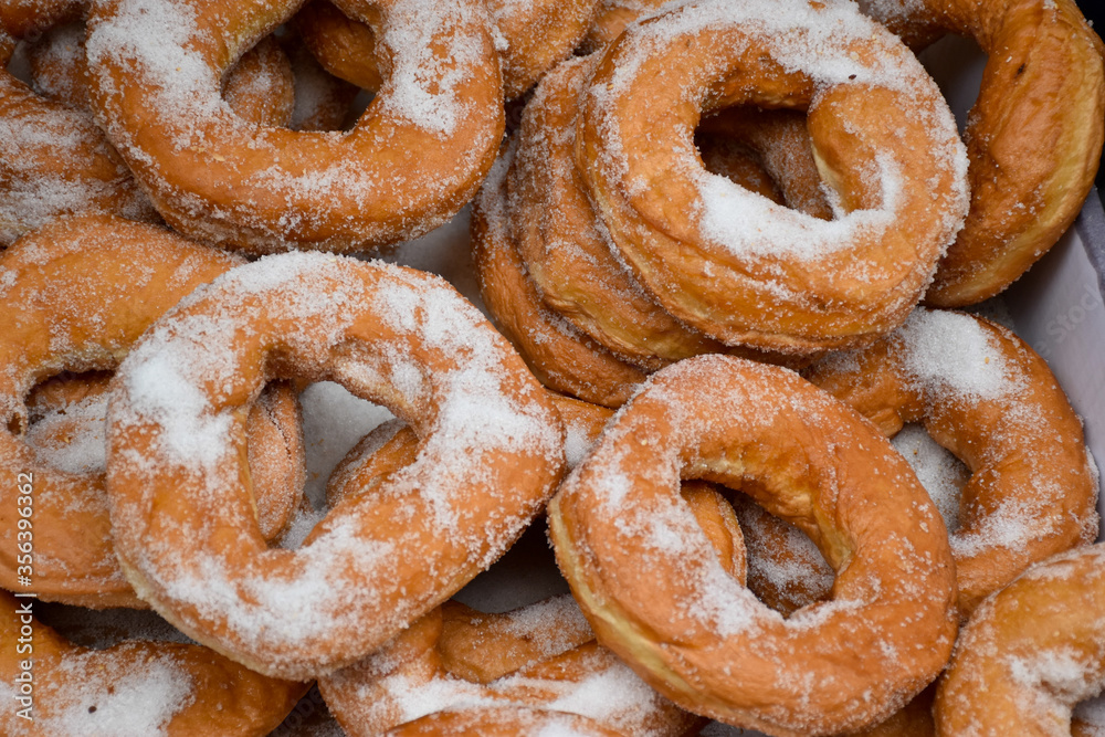 Closeup of the soft fresh ring donuts with sugar 