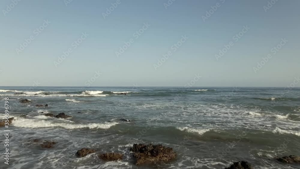Aerial View of Wavy Mediterranean Sea With Rocky Bottom, Drone Flying Forward to Horizon Aerial View of Wavy Mediterranean Sea With Rocky Bottom, Drone Flying Forward to Horizon