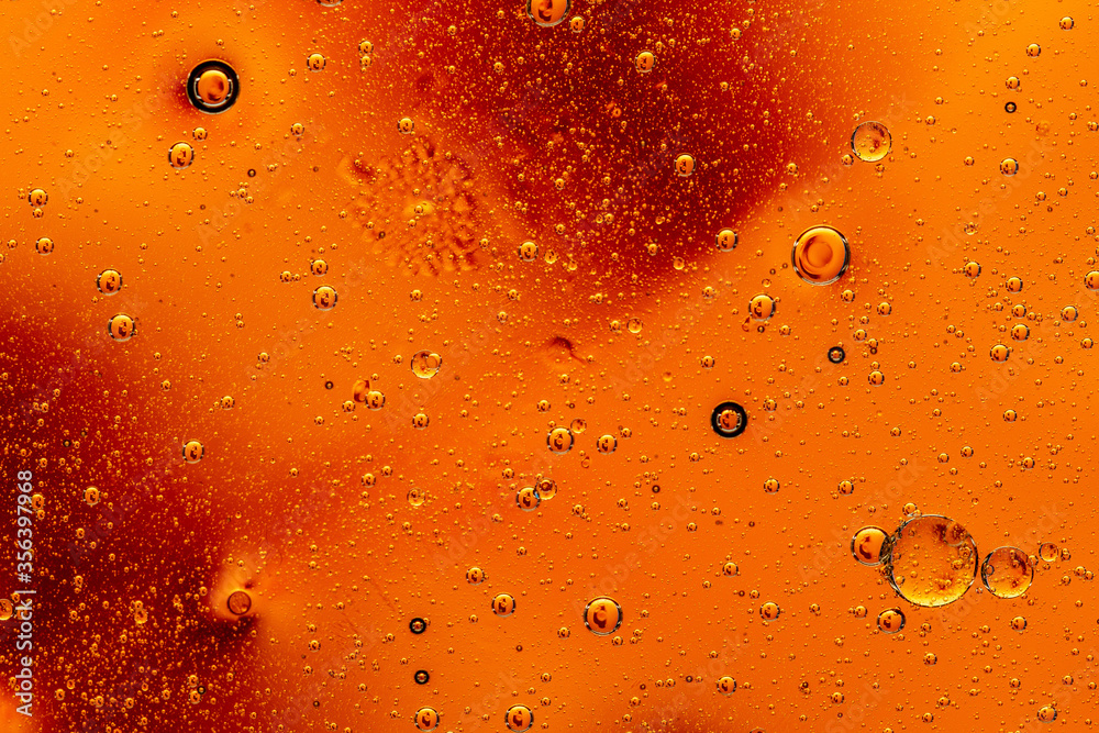 Abstract colorful background with oil drops and waves on water surface Abstract colorful background with oil drops and waves on water surface
