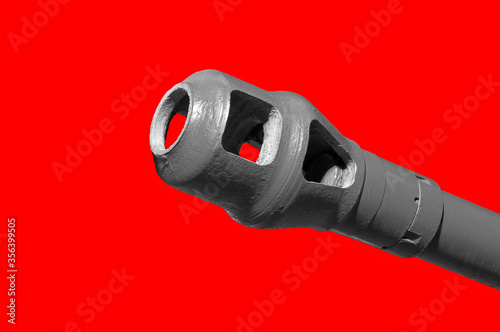Tank muzzle on red background