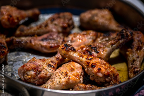 Tasty Crispy Oven Roasted Chicken Leg. Roasted chicken legs in a pan.