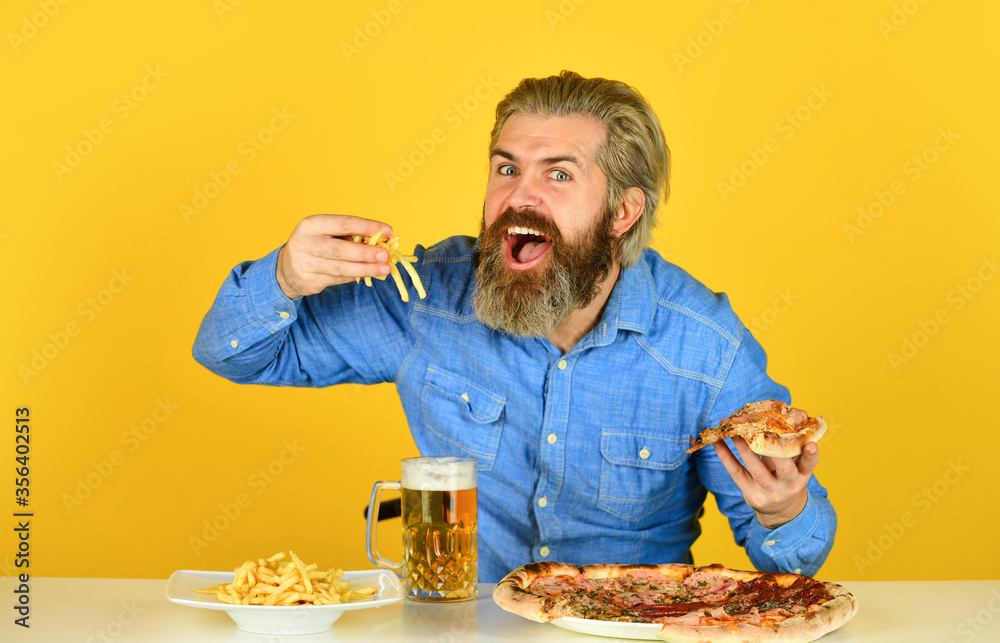 Cheerful man bearded hipster eat pizza. Dinner at pub. Hungry man going to eat pizza and drink beer. Pizzeria restaurant. Pizza party concept. Delivering happiness into mouth. Beer and food Cheerful man bearded hipster eat pizza. Dinner at pub. Hungry man going to eat pizza and drink beer. Pizzeria restaurant. Pizza party concept. Delivering happiness into mouth. Beer and food