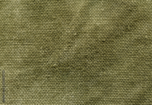 texture background of old canvas tarpaulin in green shade of color