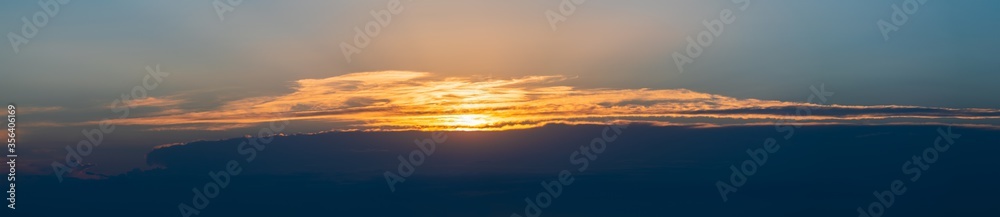 Wide panorama of beautiful colorful sunset sky