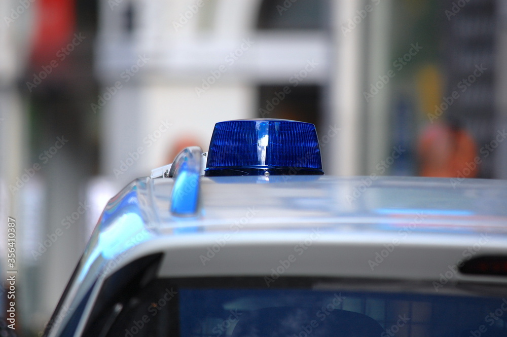Φωτογραφία Close-up of the blue lights  on top of a police vehicle.