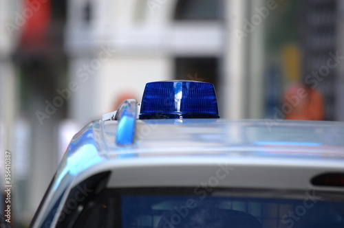 Close-up of the blue lights on top of a police vehicle.