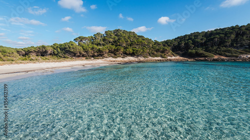 trebaluger beach, abandoned paradise beache in Menorca, a Spanish Mediterranean island, after the covid 19 coronavirus crisis photo