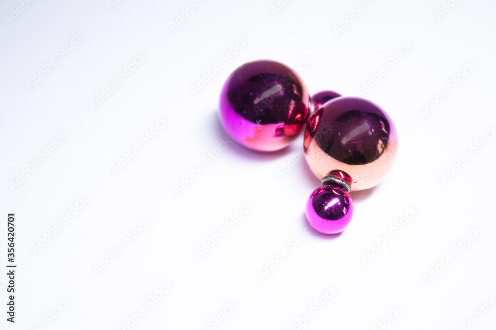 Pink round earrings. jewelry and accessories concept. Isolated, copy space. Macro Shot. High quality photo Pink round earrings. jewelry and accessories concept. Isolated, copy space. Macro Shot. High quality photo