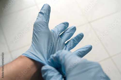 POV of a man wearing gloves during the Coronavirus Pandemic. Staying safe during COVID-19. Stay home. Stay safe.