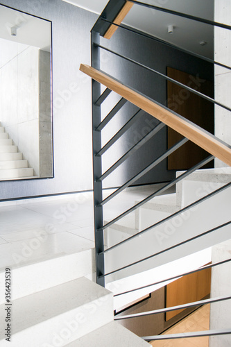 minimal staircase with stairs and steel balustrade
