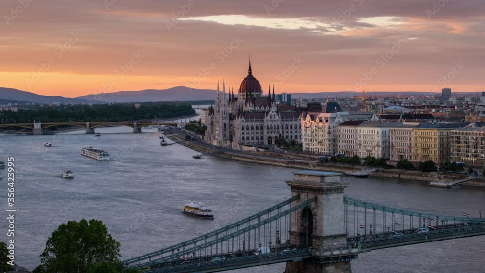 Time lapse with amazing view of Budapest with Parliament building, Chain bridge and Danube river at sunset Time lapse with amazing view of Budapest with Parliament building, Chain bridge and Danube river at sunset