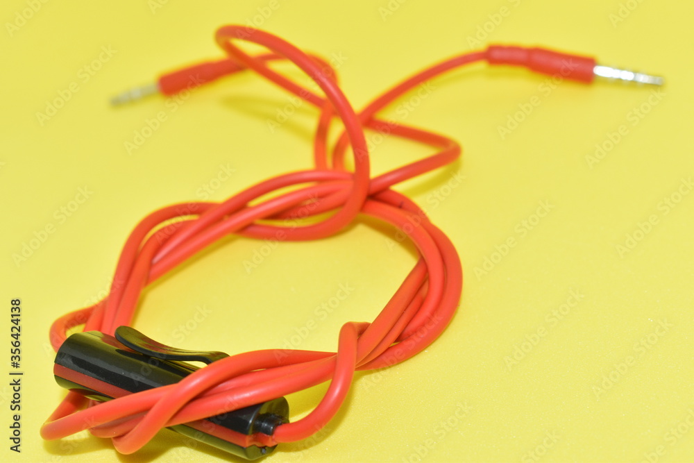 High-quality audio cable for display in yellow background. High-quality audio cable for display in yellow background.