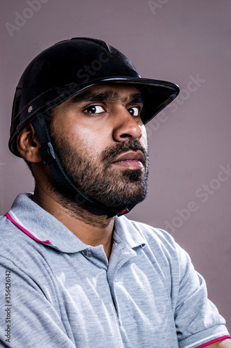 Weird looking Service Man with Helmet, Repairman with Helmet looking into camera © Martin Mohan