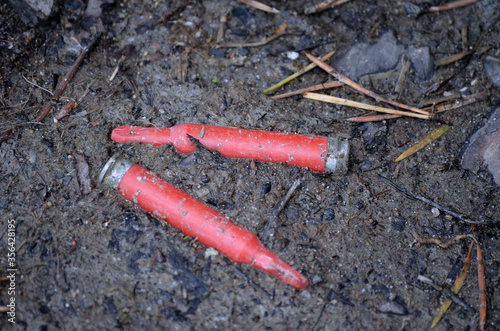 red blank training ammunition on ground