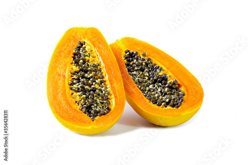 Papaya fruit with seeds isolated on white background.