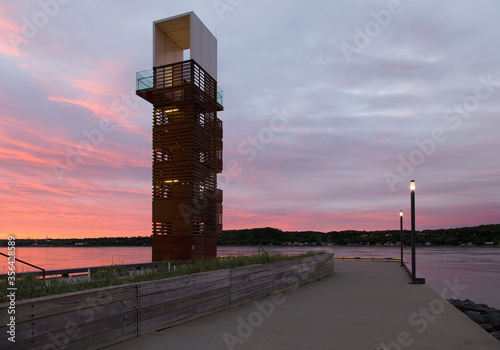 Tall public observation tower on the Samuel-De Champlain walk along the St. Lawrence River seen during dawn, Sillery area, Quebec City, Quebec, Canada photo