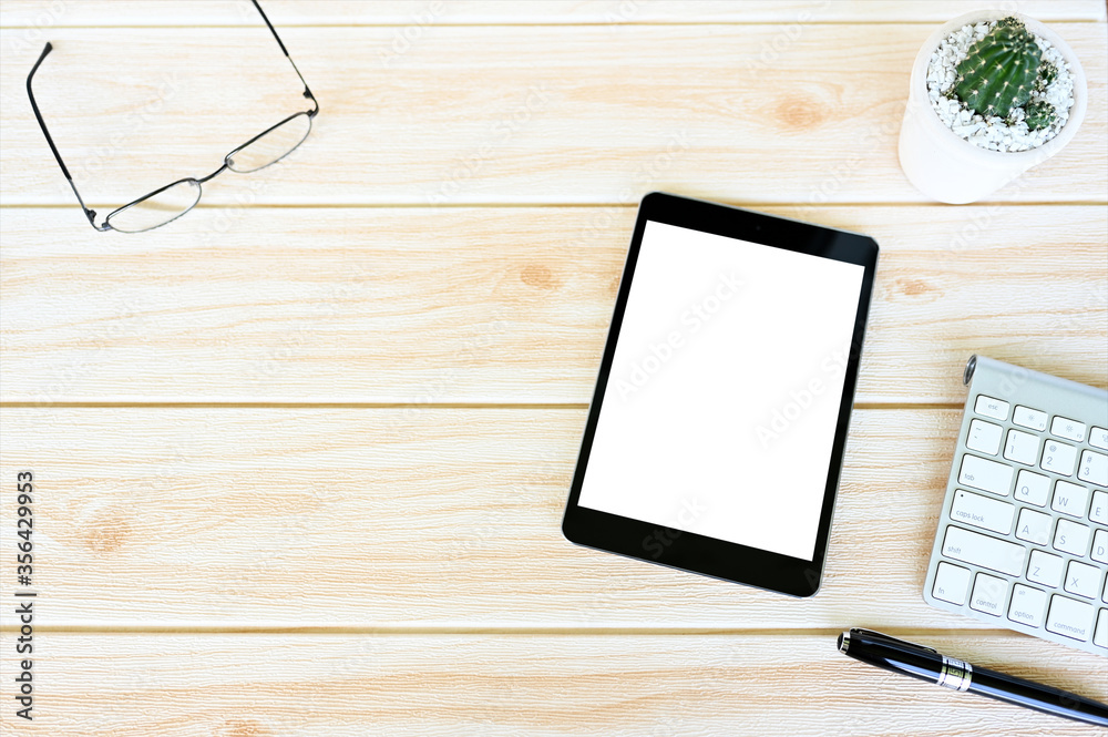 Top view tablet,smartphone ,mouse and keyboard on office desk.Top view with copy space.