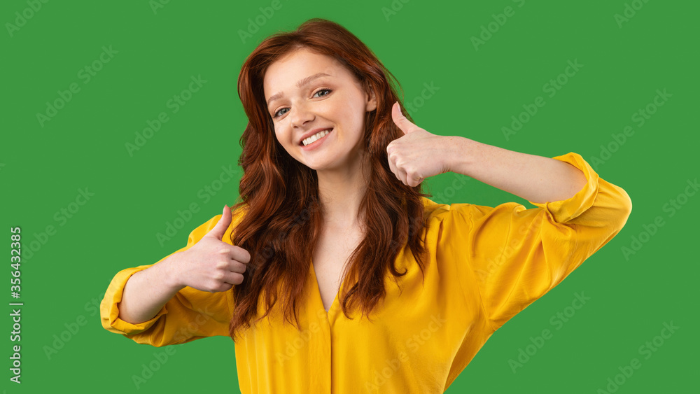 Positive Millennial Girl Gesturing Thumbs Up On Green Background, Panorama Positive Millennial Girl Gesturing Thumbs Up On Green Background, Panorama