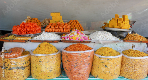 Traditional Indian chat food consisting of Sweet and Spicy dishes sold across the streets in Karnataka state / India. photo