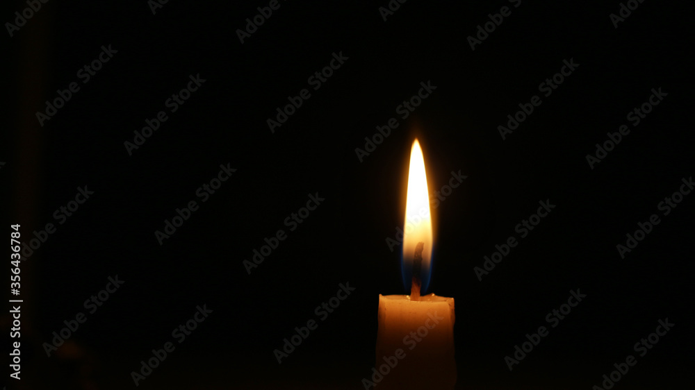 Candle flame candle light on black or dark background Candle flame candle light on black or dark background