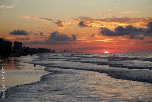 Sunrise on the ocean seashore 