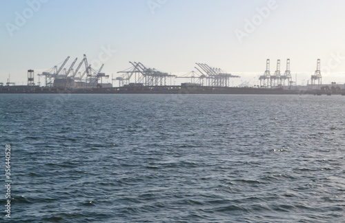 Long Beach shipping and container port with cranes loading cargo, USA © othman