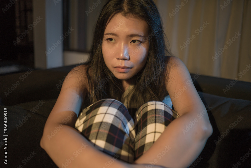 custom made wallpaper toronto digitalyoung beautiful sad and depressed Asian Chinese woman lying in pain crying at living room sofa couch feeling stressed and worried suffering depression