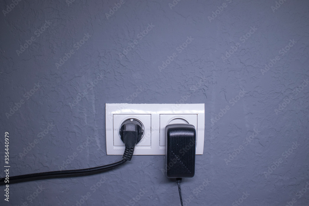 Sockets for electrical appliances on a light gray wall. a multifunction outlet. High quality photo