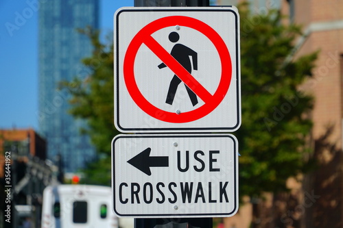 No pedestrians use crosswalk, sign 