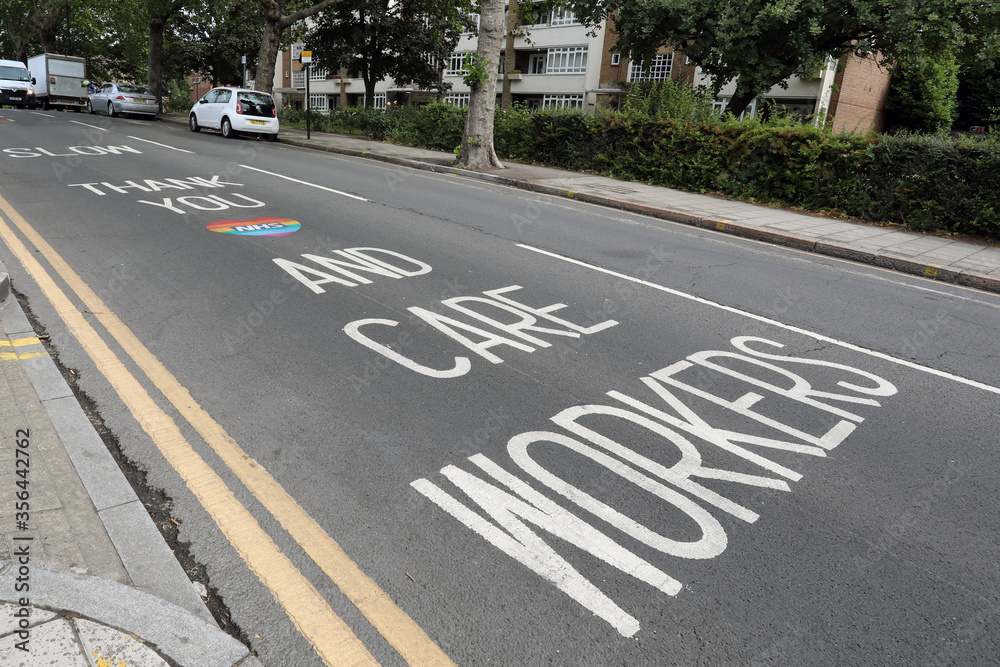 Obraz premium London / UK – June 7, 2020: a message thanking NHS and care workers written on Park Road, Crouch End, north London, amid the ongoing coronavirus crisis