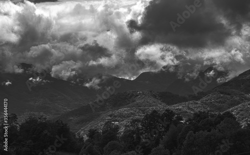 Mysterious black mountain with dramatic cloudy sky 