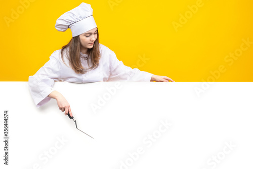 Chef shows a banner way. Gi...