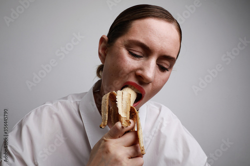 Young woman with banana. Safe sex concept photos.