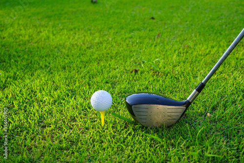 Golf balls on the golf course with golf clubs ready for golf in the first short. In the morning, with the beautiful sunlight.Sports that people around the world play in the holidays