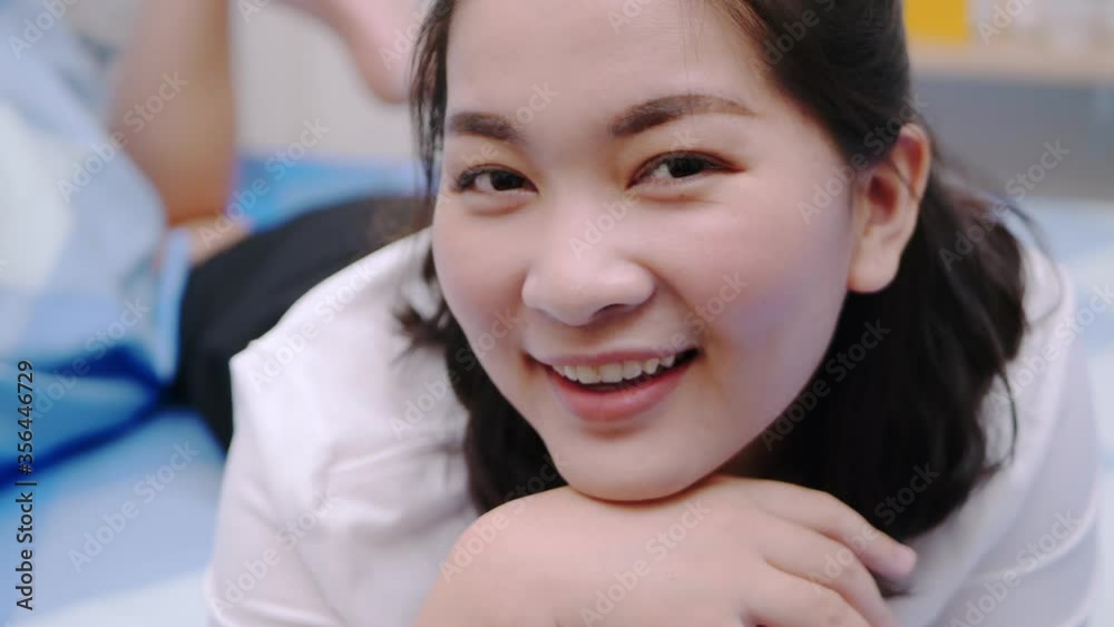 Asian women beautiful and smiling are extremely happy and content lying on the bed for holiday time and relax with clear light, scene of slow motion.4K 23.97fps Asian women beautiful and smiling are extremely happy and content lying on the bed for holiday time and relax with clear light, scene of slow motion.4K 23.97fps
