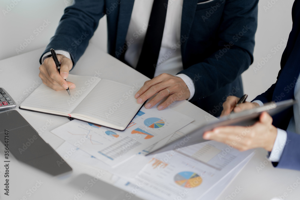 Financial inspector calculating a numbers in office room. Financial inspector calculating a numbers in office room.