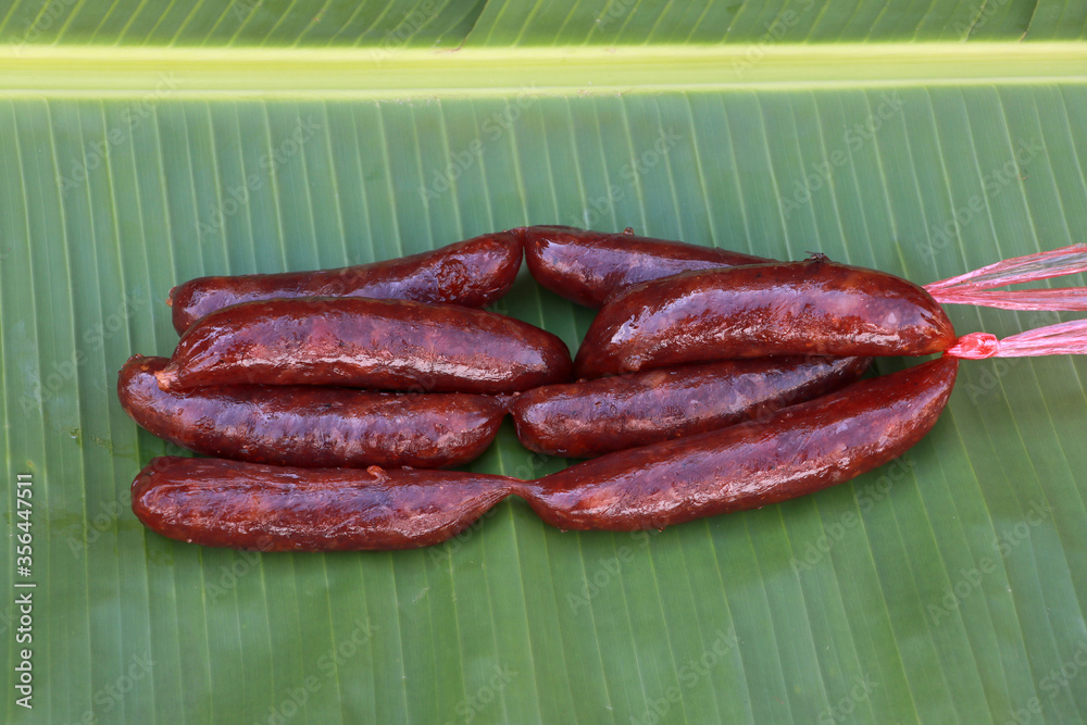 Chinese sausage on the banana leaves and ready to cook.