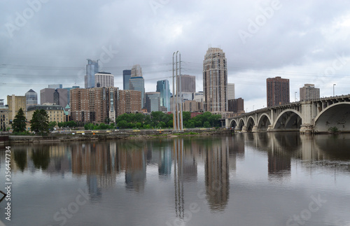 Minneapolis downtown skyline and Third Avenue Bridge above Mississippi river. Midwest USA Minnesota state.