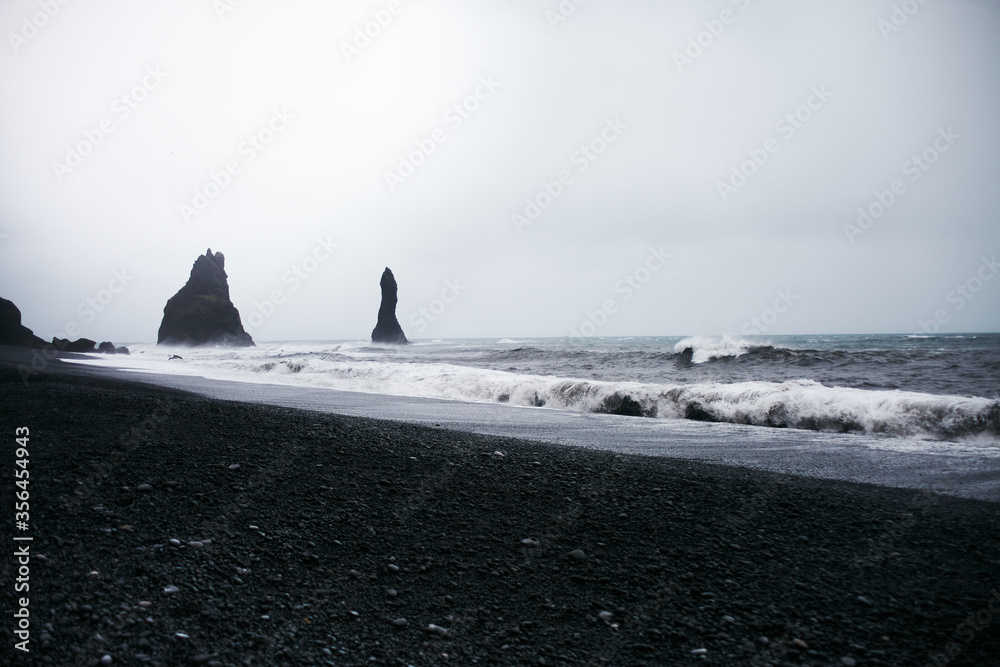 Sea Stacks and Basalt Clifs to the East of Reynisfjara Black Sand Beach, Vik in Southern Iceland.