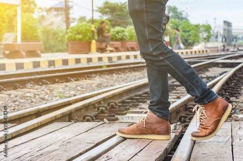 man on railroad tracks