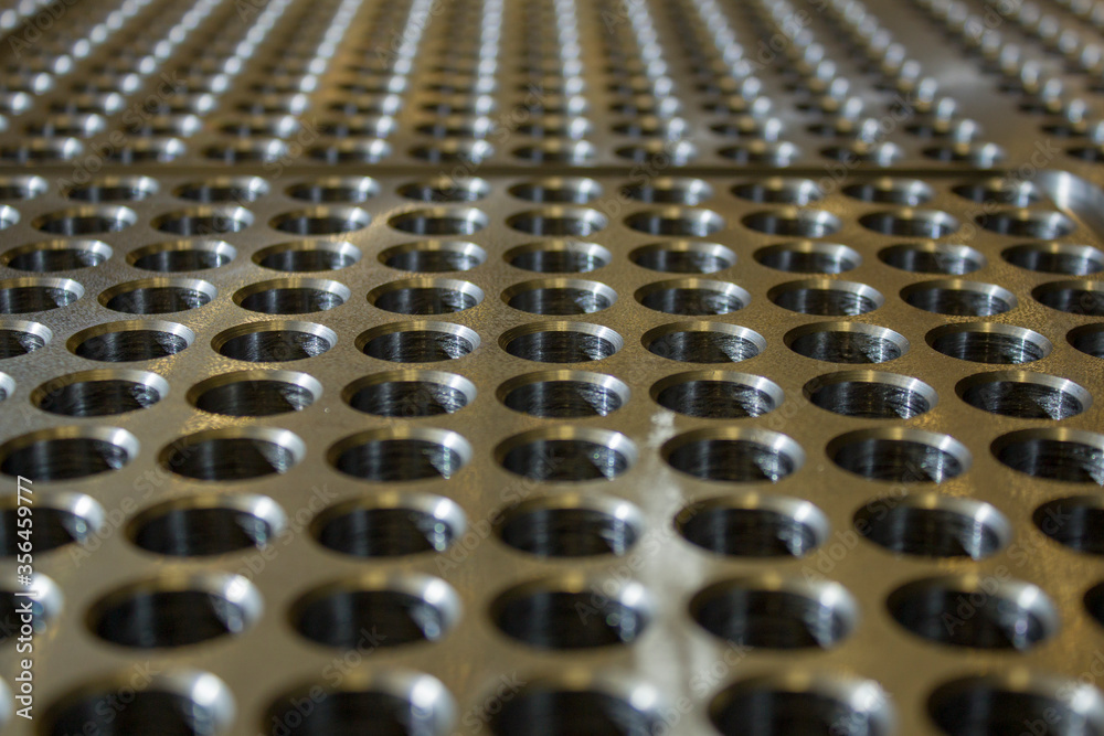 Fototapeta premium holes in thick metal for heat exchanger