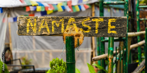 Photography Shield with written indian word Namaste at the entry in cafe