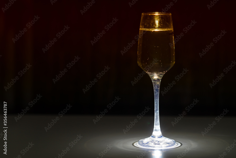 Elegant glass of white wine or champagne Elegant glass of white wine or champagne