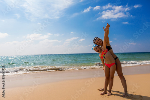 Young girl with a girl in masks for snorkeling. Happy people.