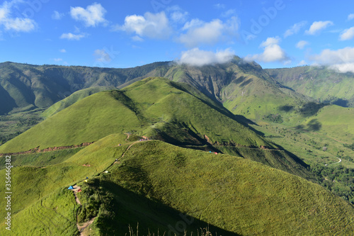 View of green hill on the spring. Bukit Holbung. Indonesia photo