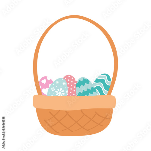 happy easter eggs painted in basket