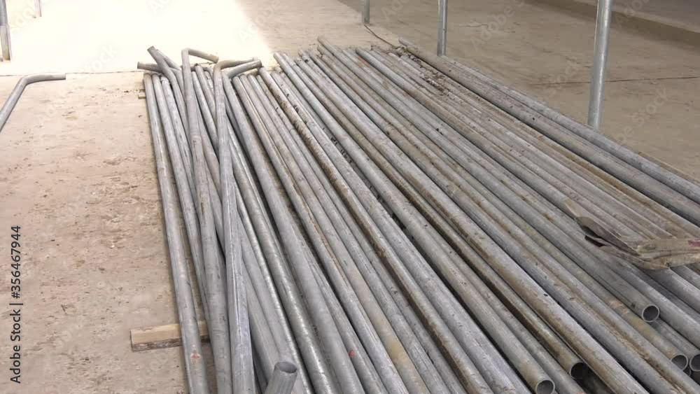 Pile of many different sizes of building material galvanised steel on the floor.
Pile of many different sizes of building material galvanised steel on the floor.